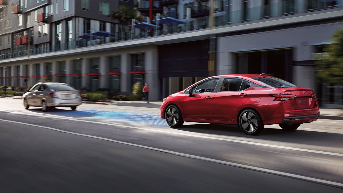 2025 Nissan Versa showing safety shield 360 sensors while driving downtown.